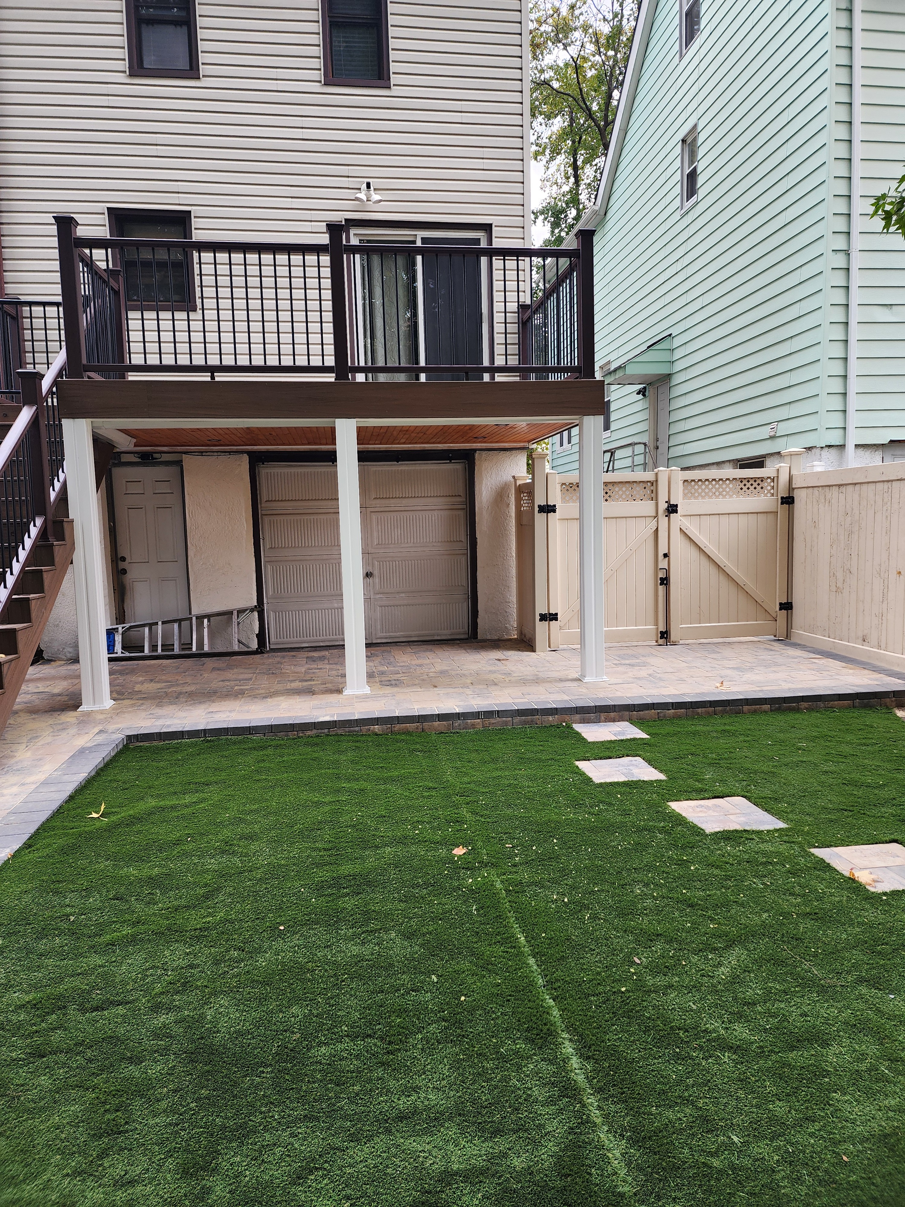Trex composite deck with recessed lighting, and Transcend railings in Queens, NYC