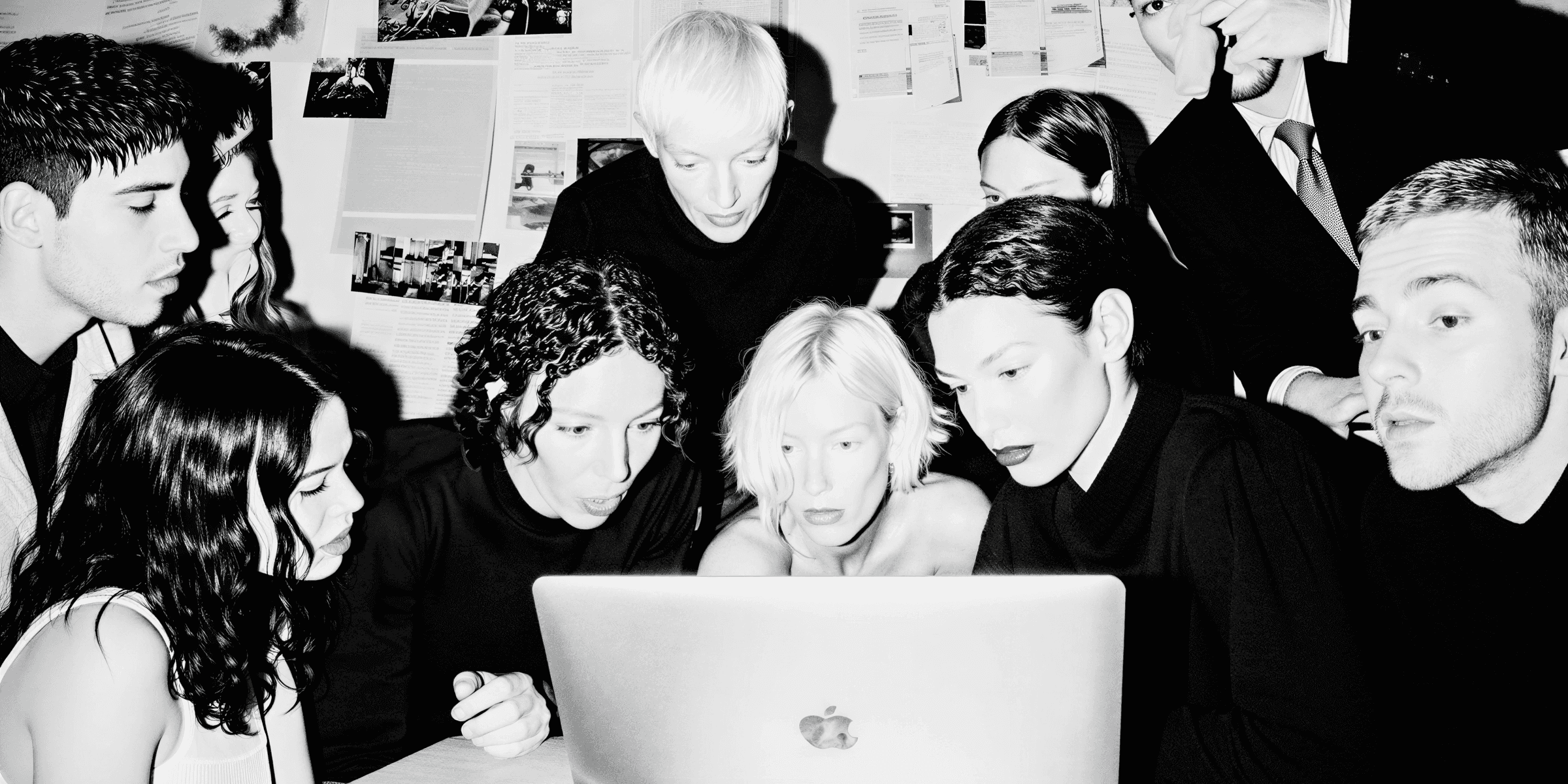 group-people-sitting-looking-laptop-black-and-white-marketing-agency