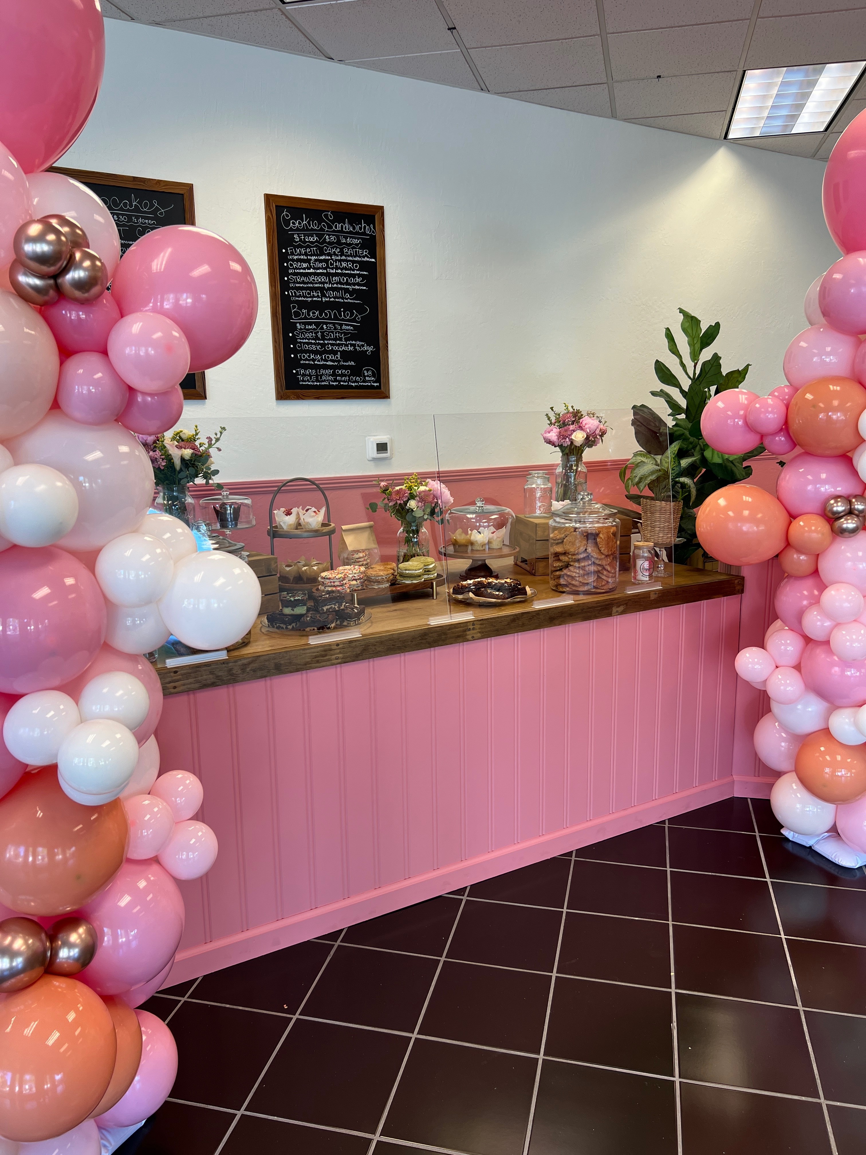 Barista pouring milk into latte with art