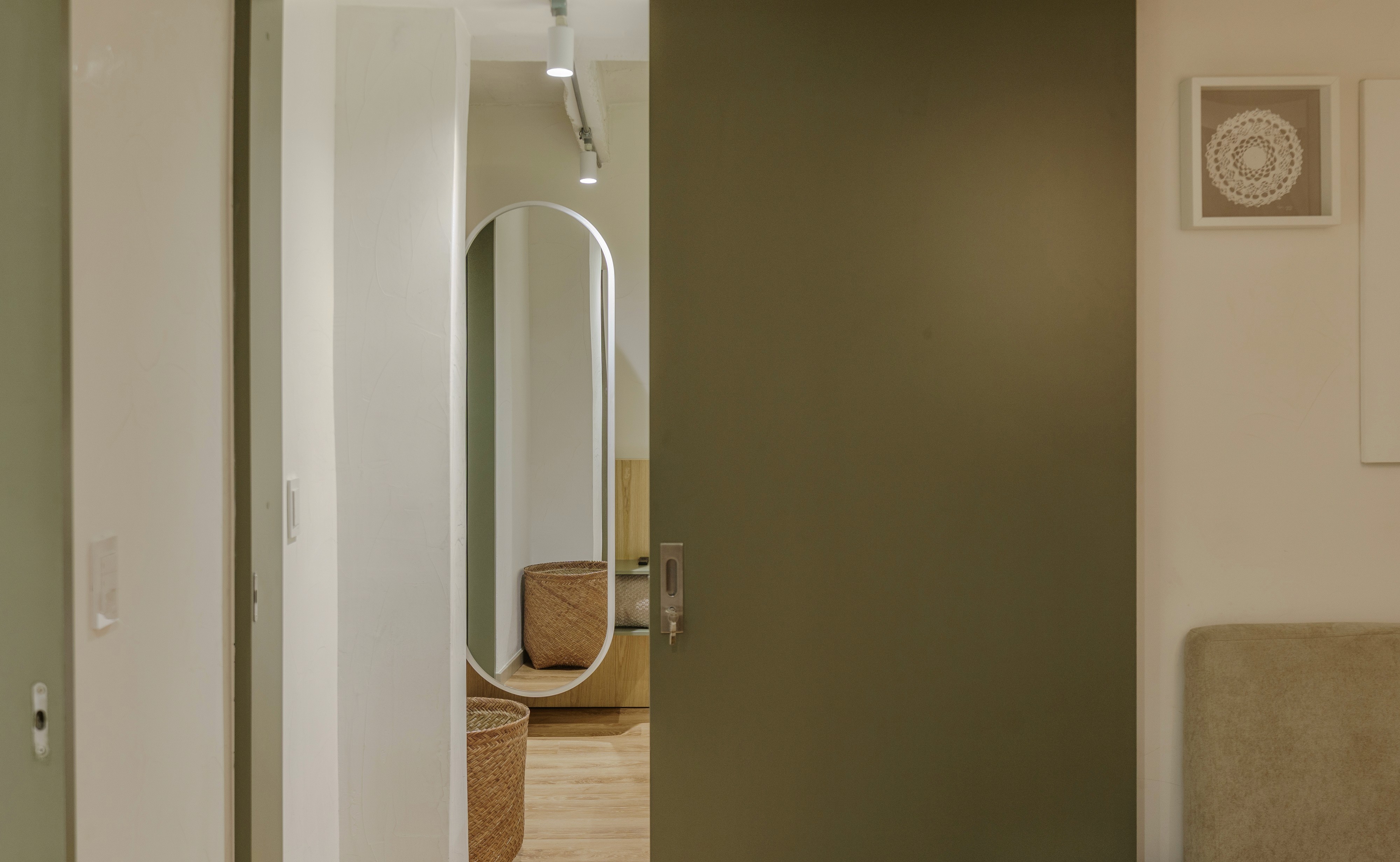 Double-height interior with flowing sculptural forms and warm raking light