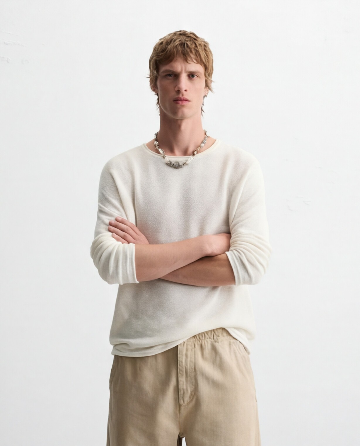 Off-White Knit with Relaxed Beige Trousers