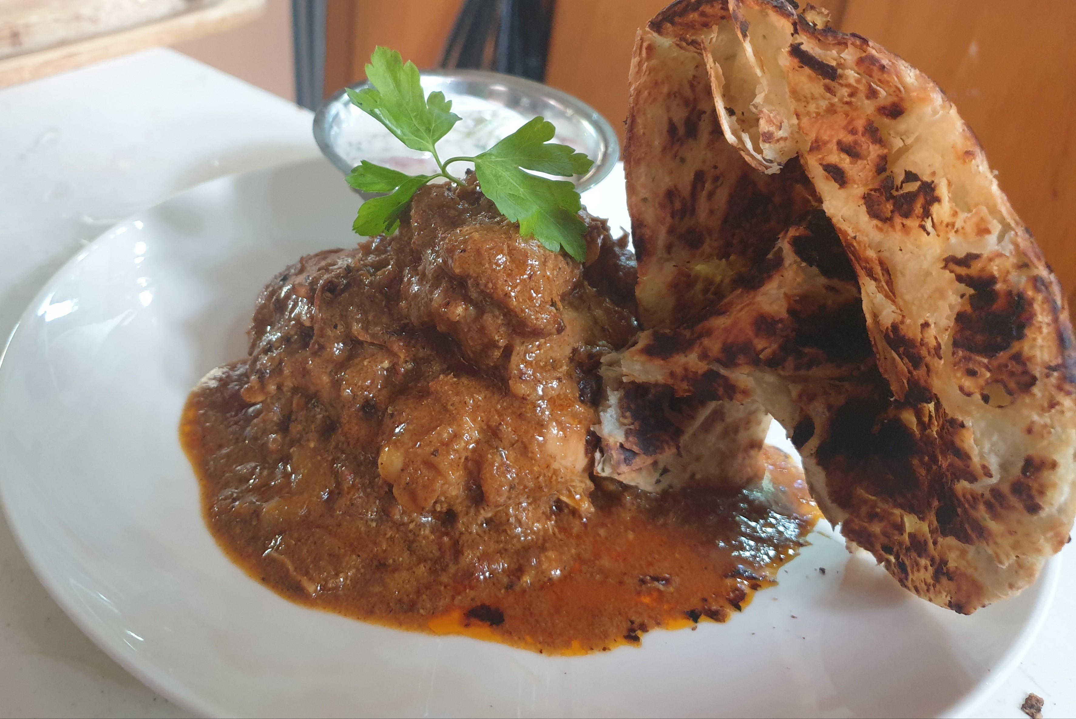 South Indian Chicken Curry with crispy naan.