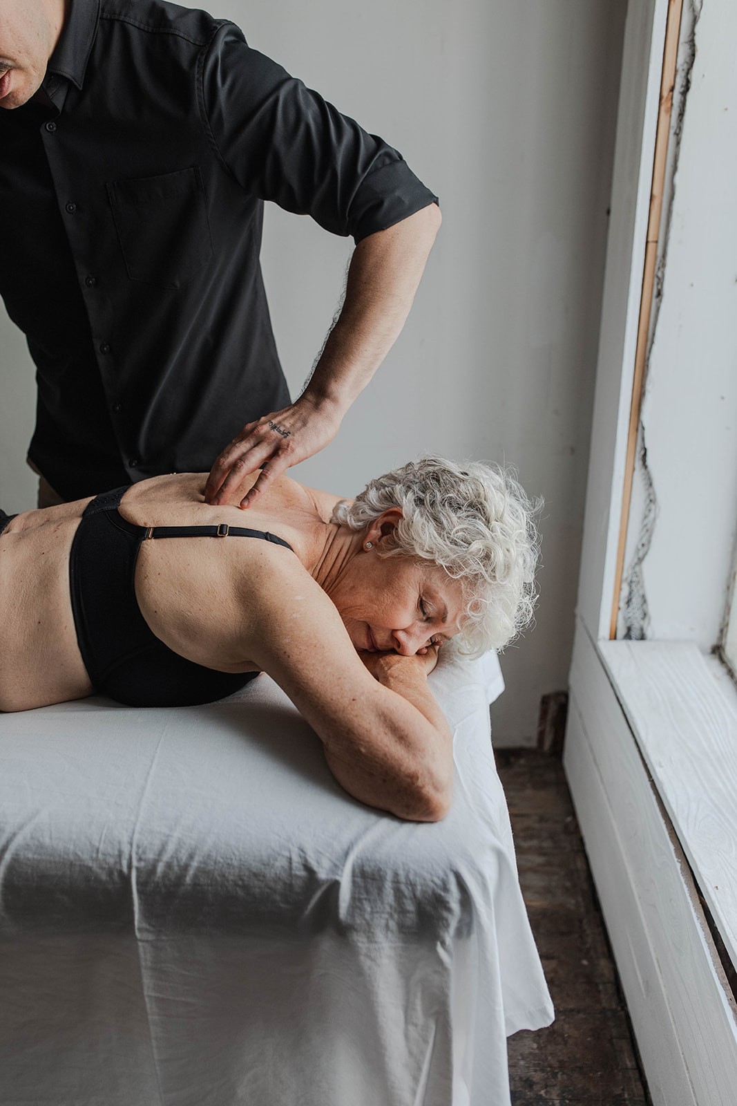 Ryan relieving neck pain with Rolfing for client in Sacramento.