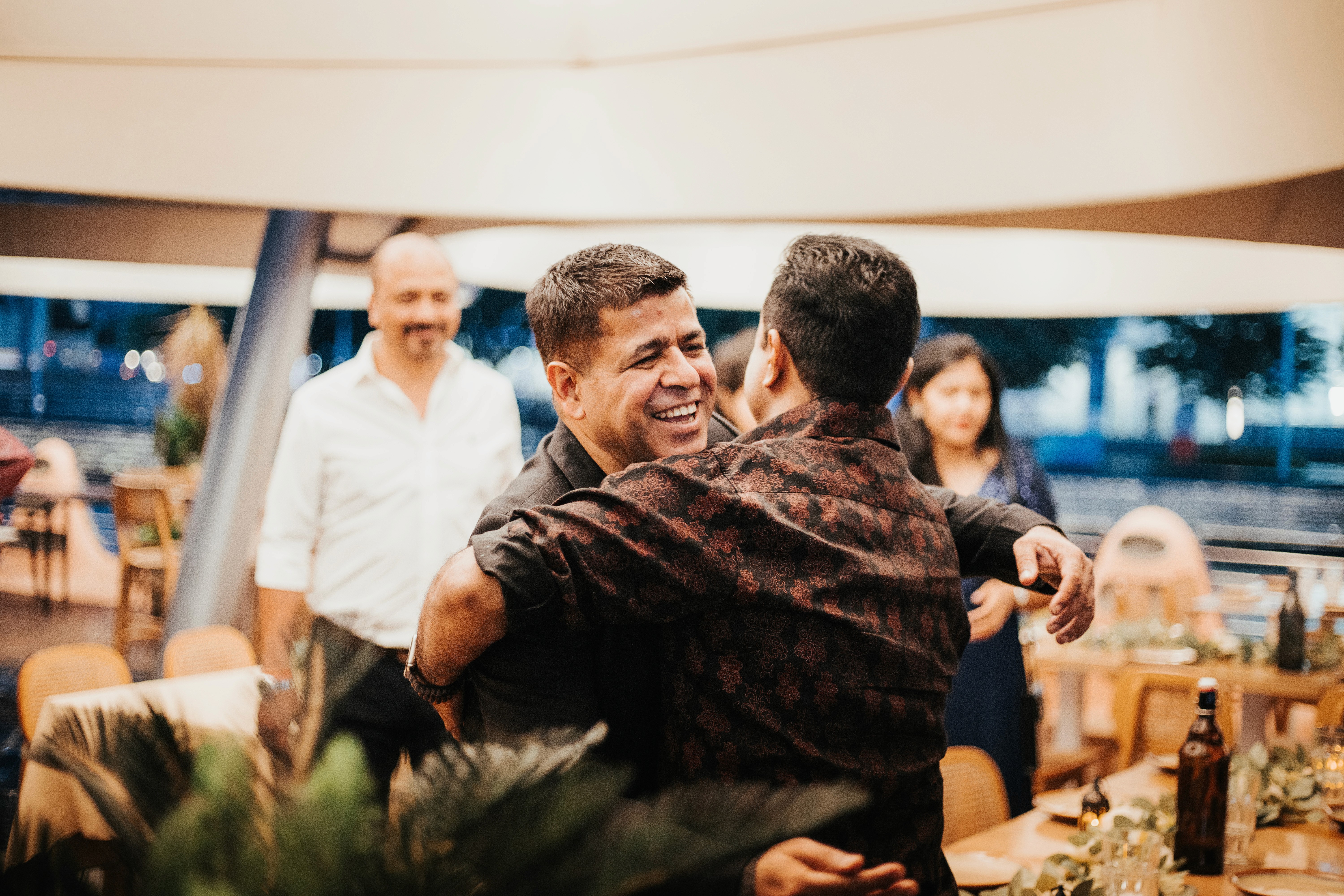 Vibrant energy and celebratory dancing during a festive Indian event.

