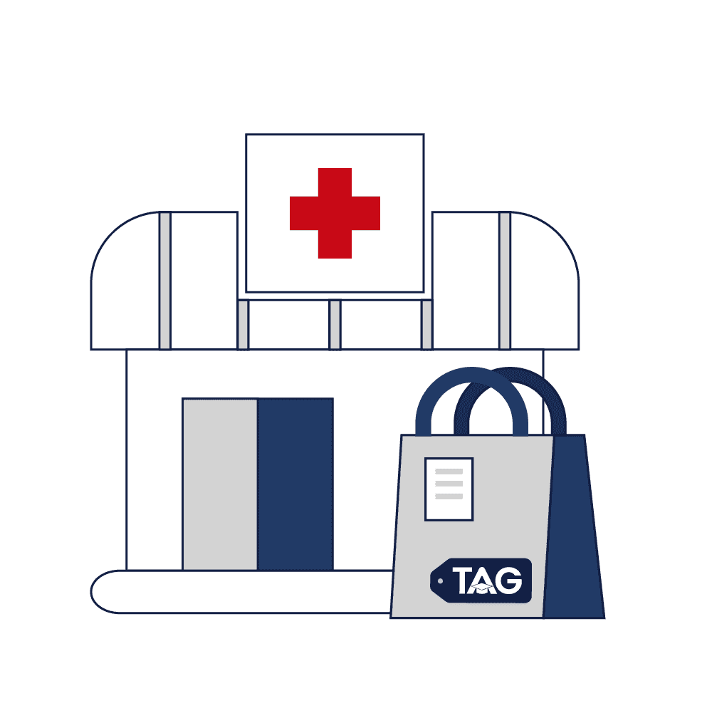 Pharmacy building with red cross and blue medicine bag