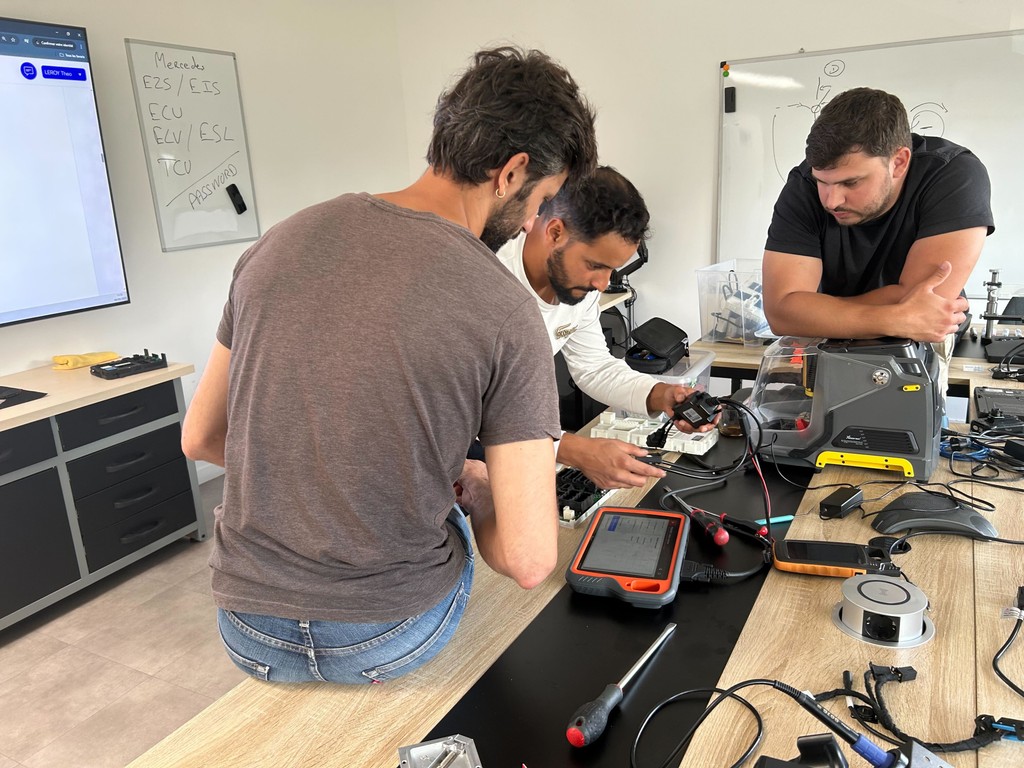 A man stading with Surfboard
