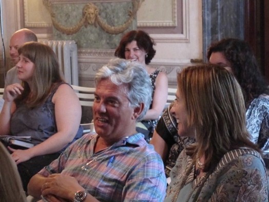 A photo of a group of persons listening to a lecture.