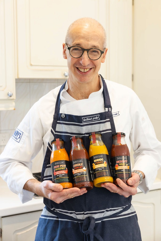 Chef holding Butcher's Pride Cooking Sauces