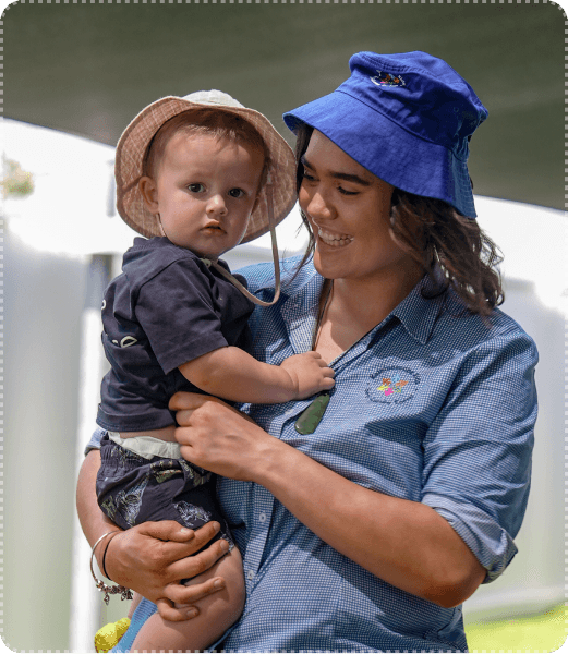 Children reading outdoors with their educator at Kaleidoscope Kids Early Learning Centre, alongside a smiling toddler and a 4.6-star Google Reviews badge showing parent satisfaction.