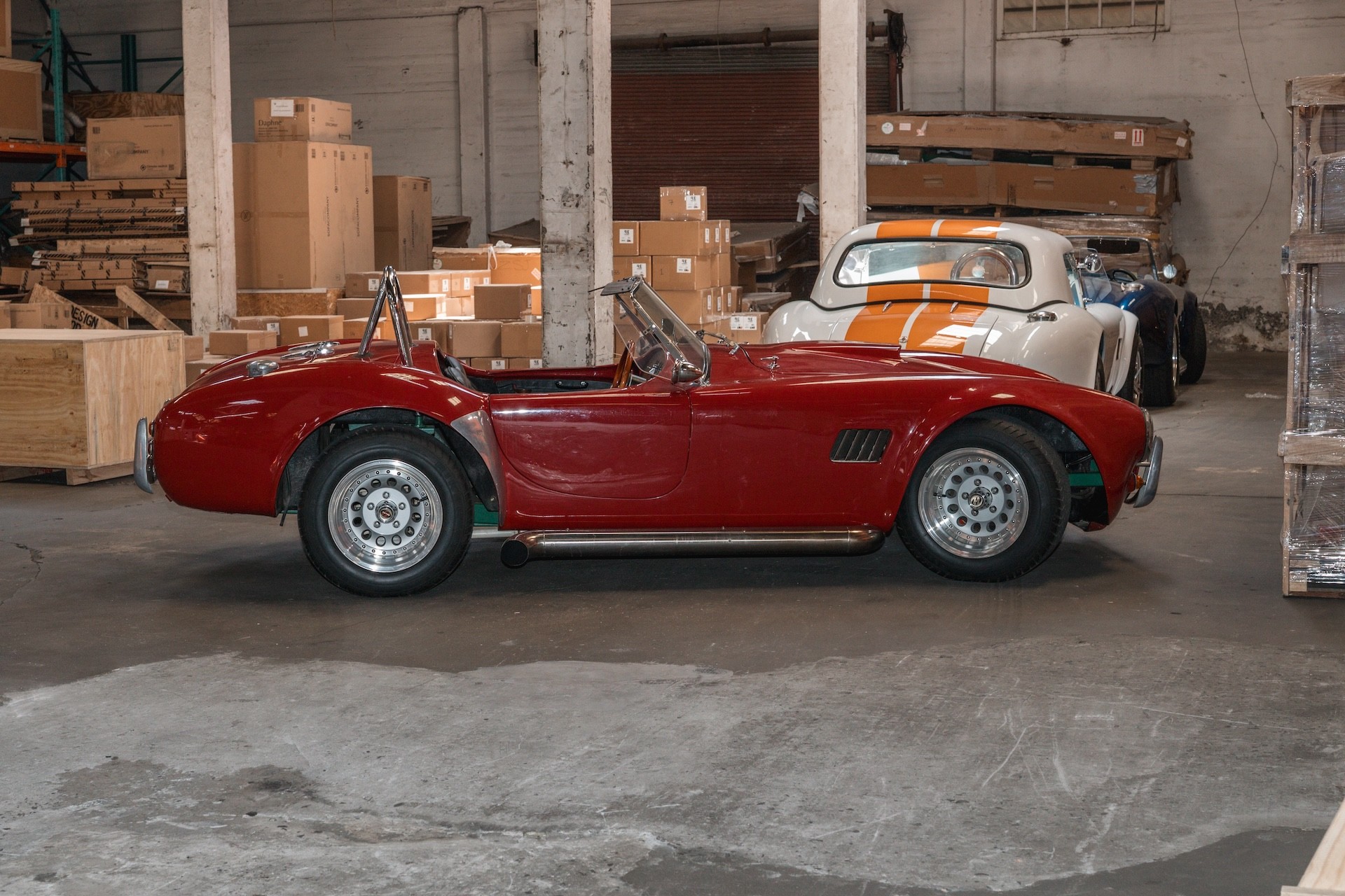 Team of workers assembling heavy-duty wooden packaging for a turnkey project.