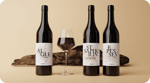Lifestyle shot of red wine bottles and wine glass decorated with wood, on brown surface