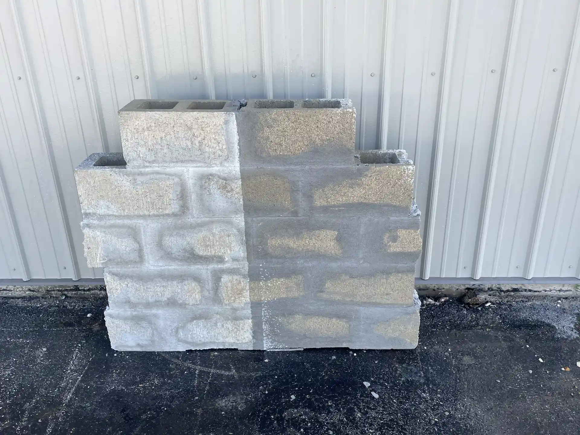 Concrete blocks that have been sprayed with water. Halfhave been covered in Rub-R-Seal and are still dry.