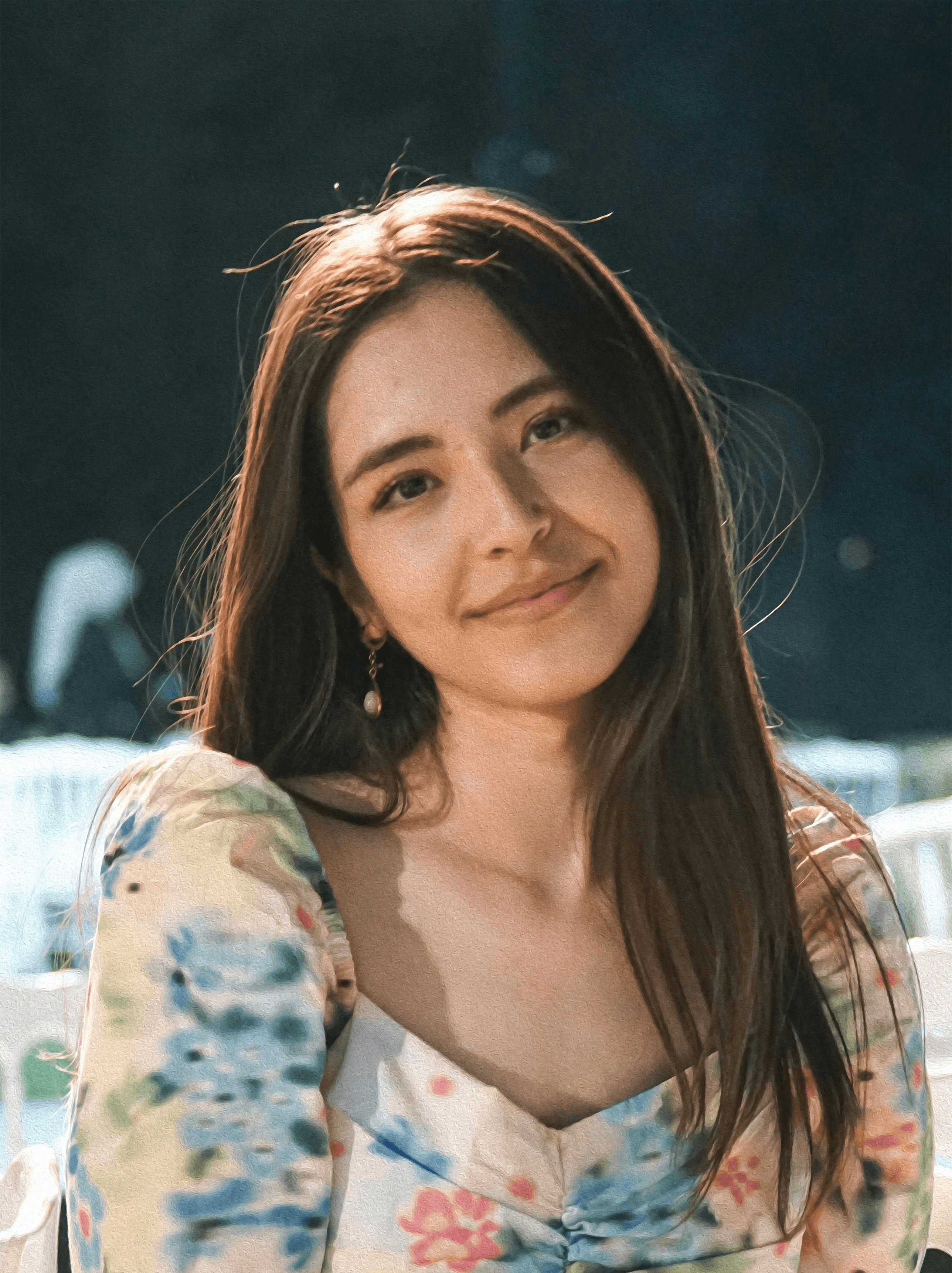 a woman sitting on a white chair next to a table