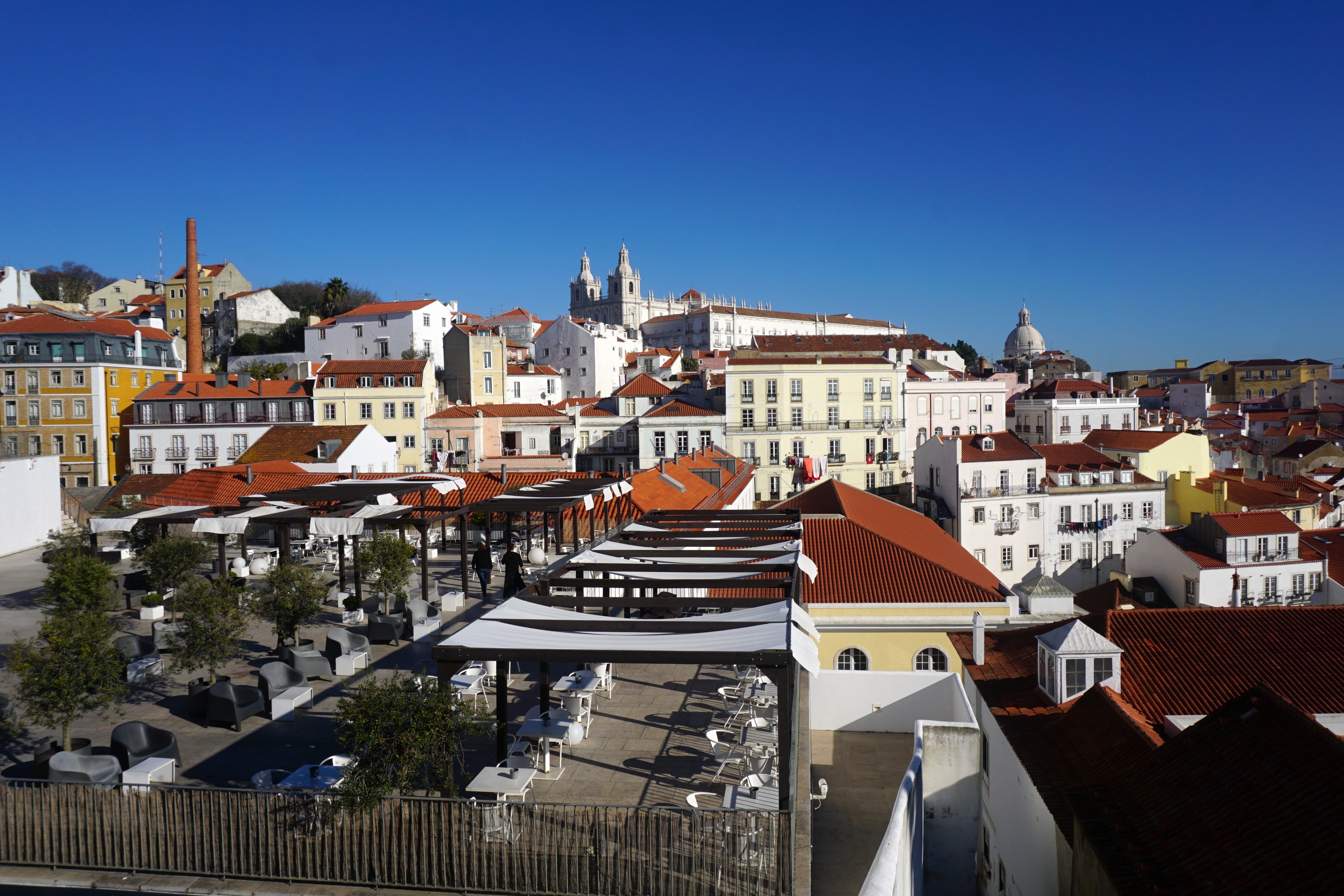 Alfama rooftops and the Portas do Sol terrace in Lisbon.