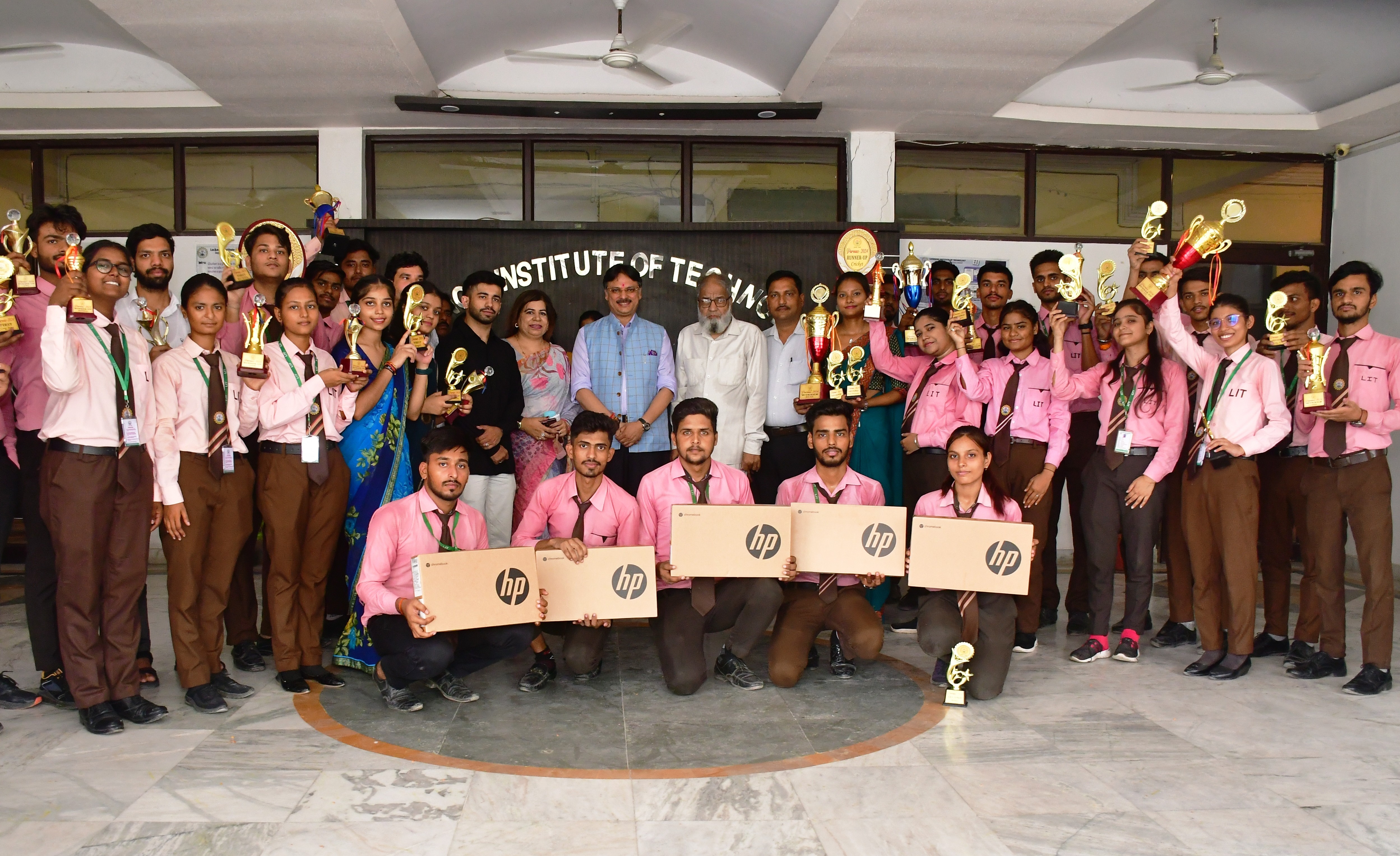 people sitting on chair in front of table while holding pens during daytime