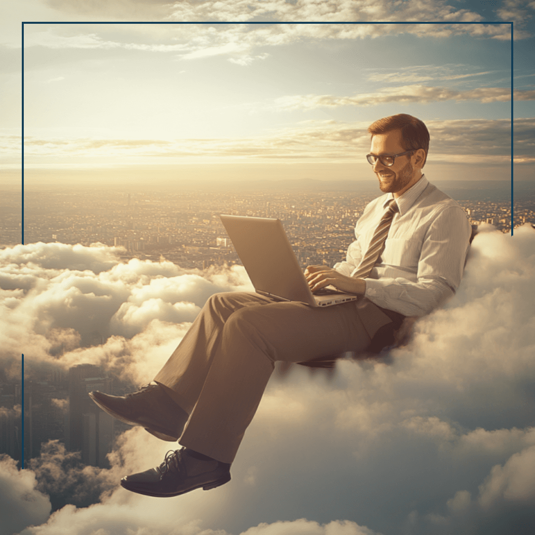 Ein glücklicher Mann mit Laptop, der auf einer Wolke sitzt