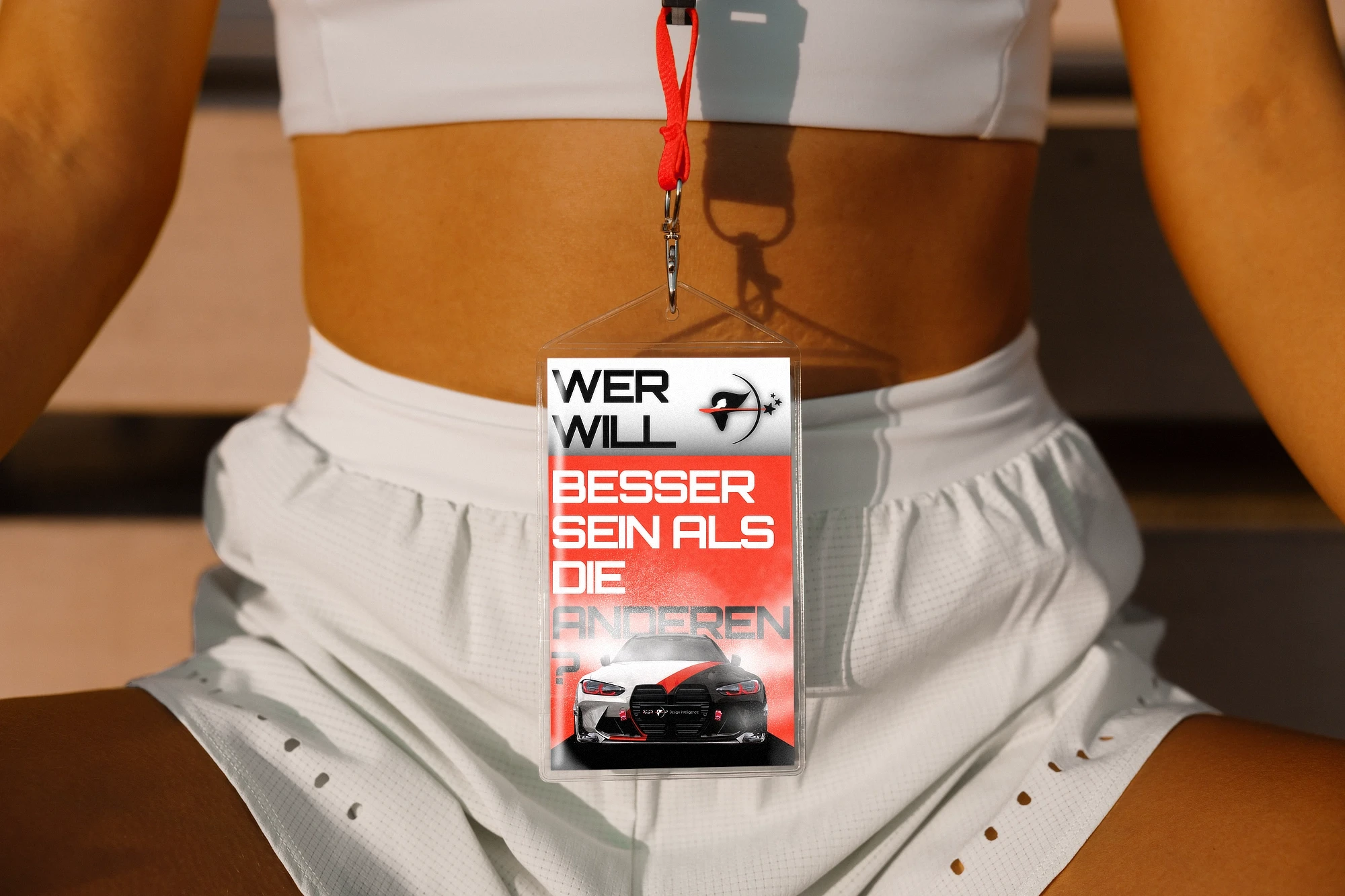 Flyer design adapted as a wearable badge on a lanyard, demonstrating flexible brand application across real-world touchpoints by PFiFR Design Intelligence.