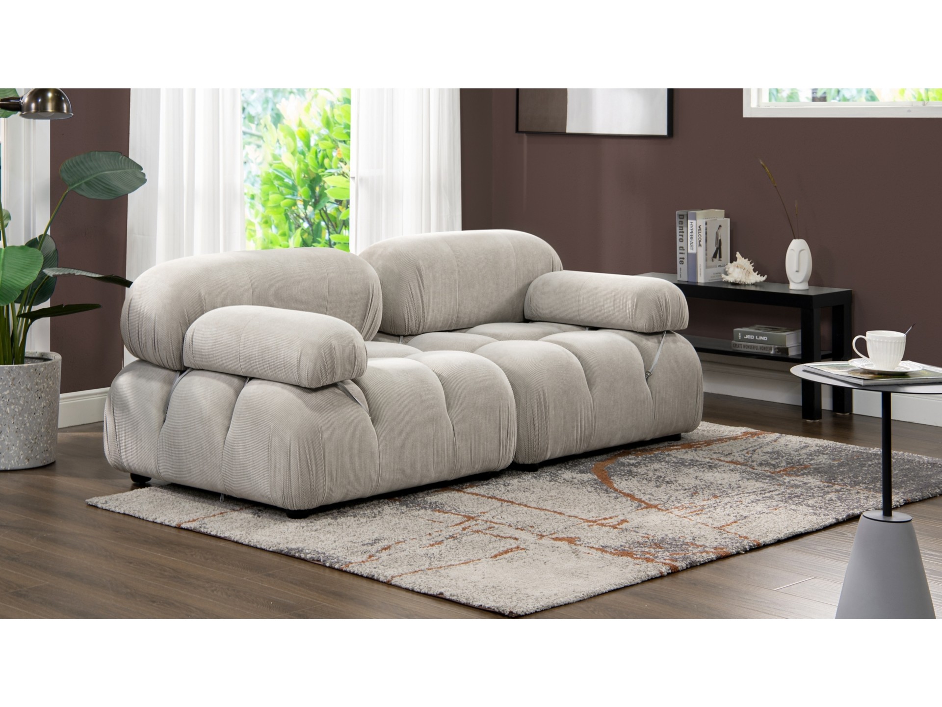 Comfortable corduroy couch featuring deep seating and a warm texture, perfect for relaxing in modern spaces.