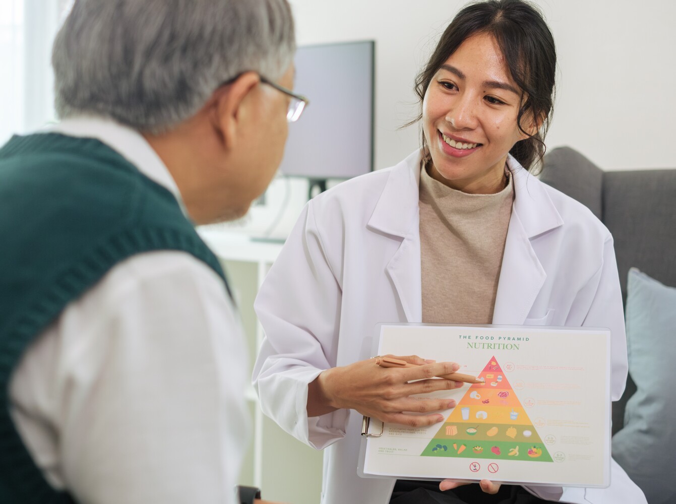 older man meeting with a dietitian to discuss nutrition support for weight loss medicine