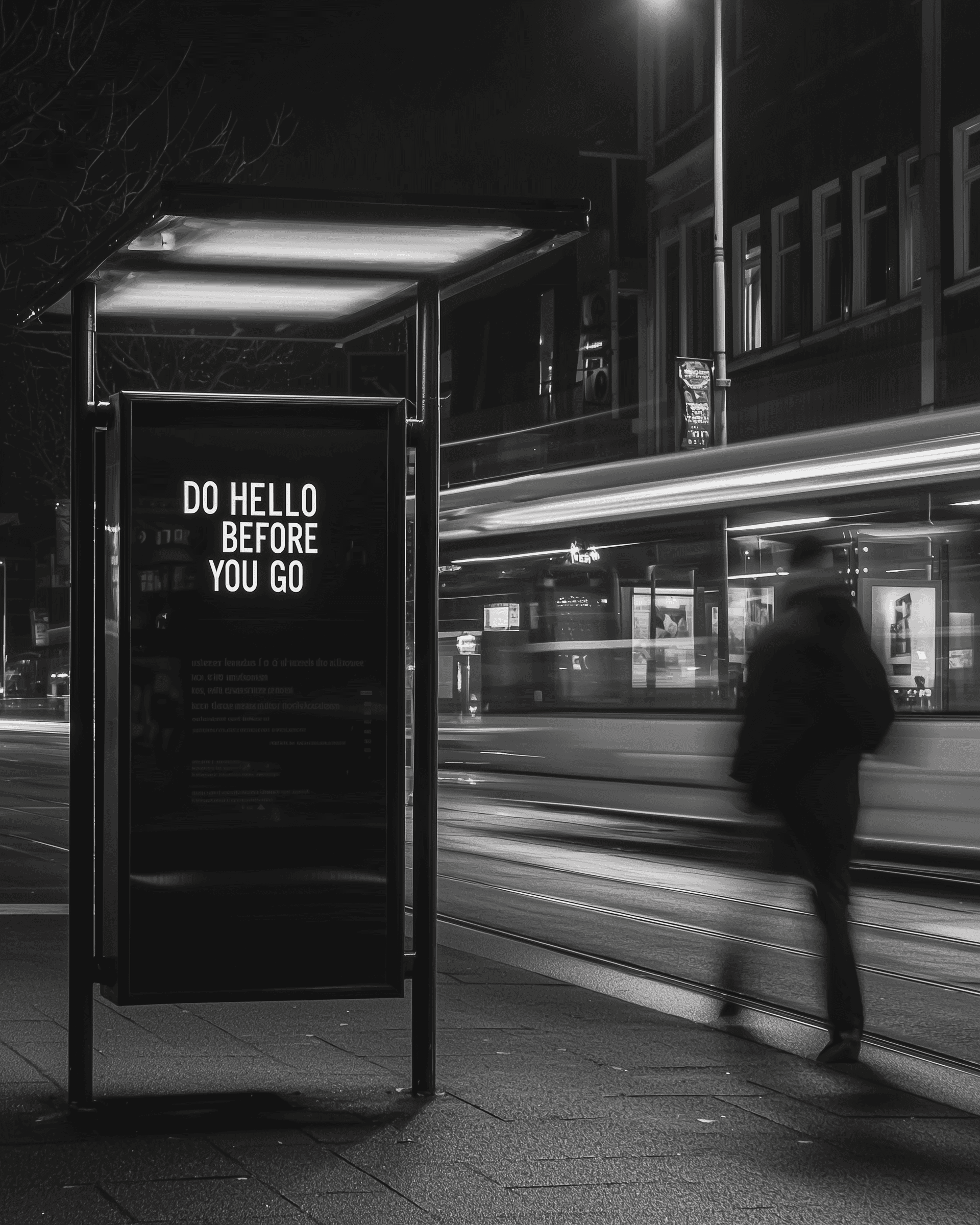Street scene with motion blur and sign saying “Do hello before you go”