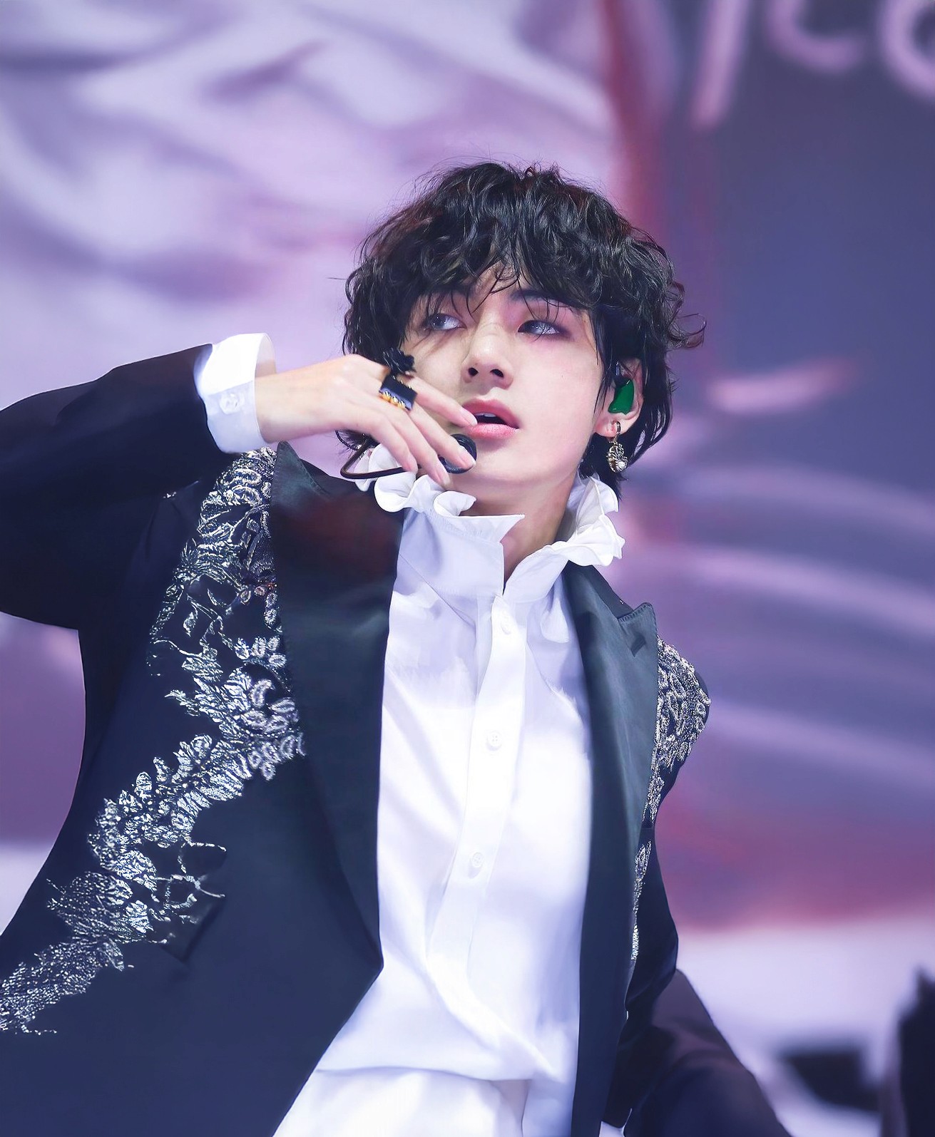 V of BTS performing at a concert, photographed by Love, Affection
