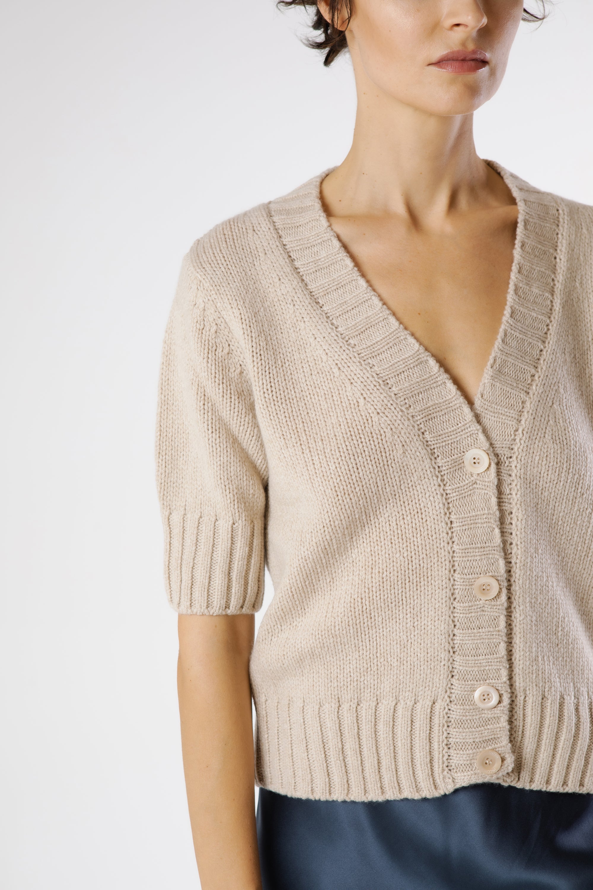 Close-up of Artemisa Cashmere Cardigan Sphinx showing premium cashmere texture and tonal button details.