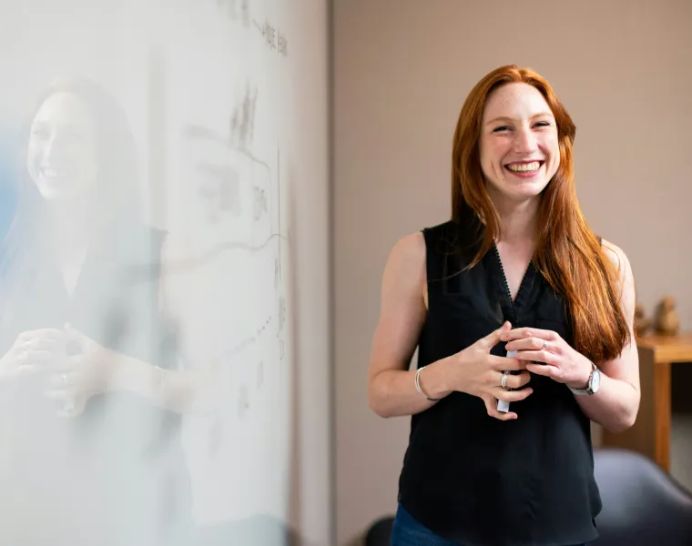 Smiling woman in work environment