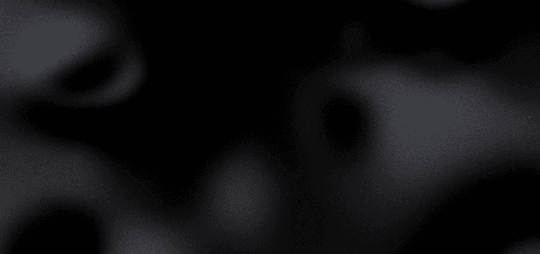 A gradient image transitioning from dark black to light gray tones.