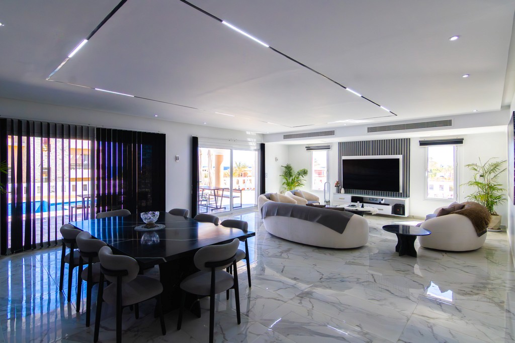 brown wooden house with green grass field