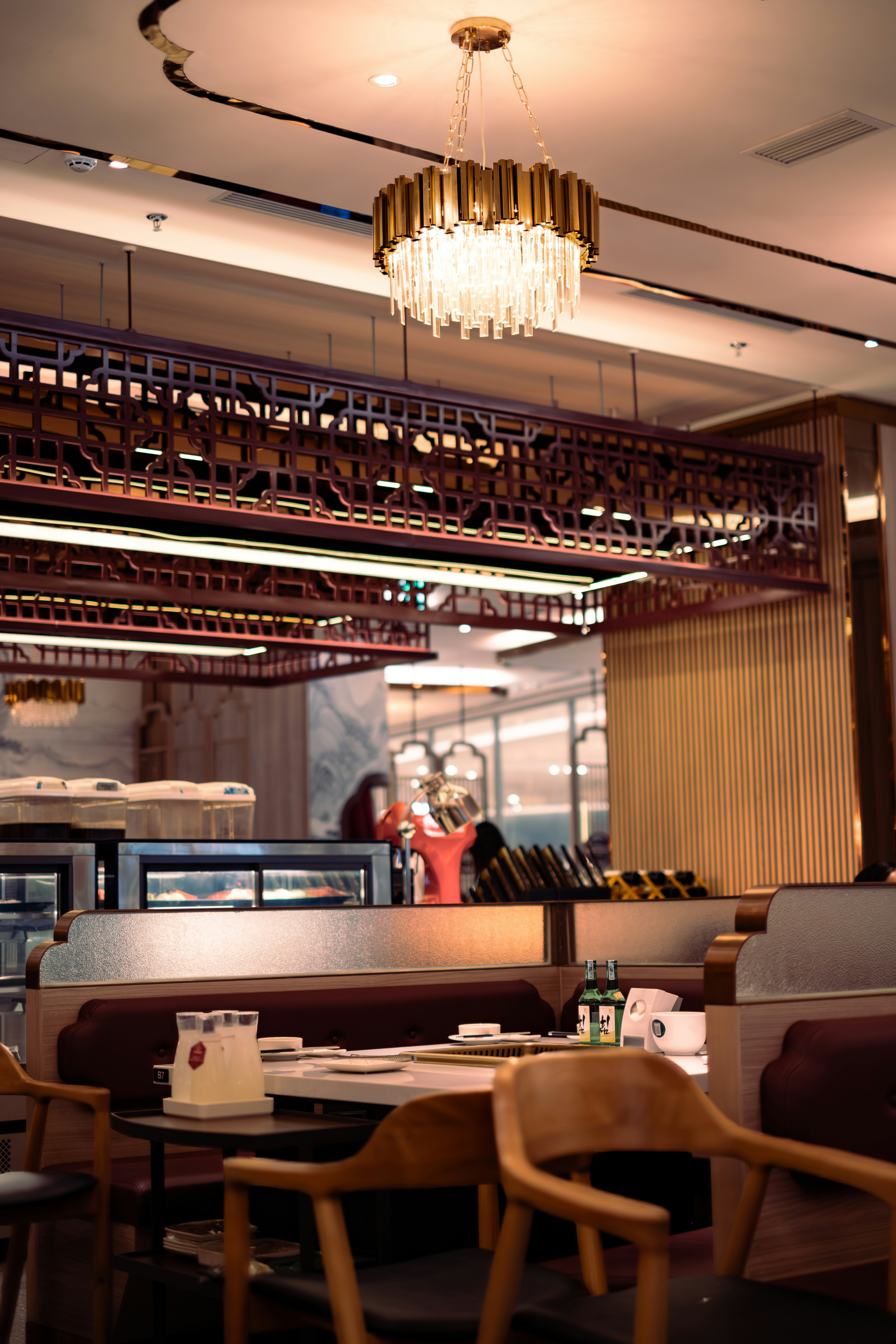 a restaurant with a chandelier hanging from the ceiling