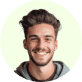 A man smiling brightly inside a vibrant green circle, radiating joy and positivity.