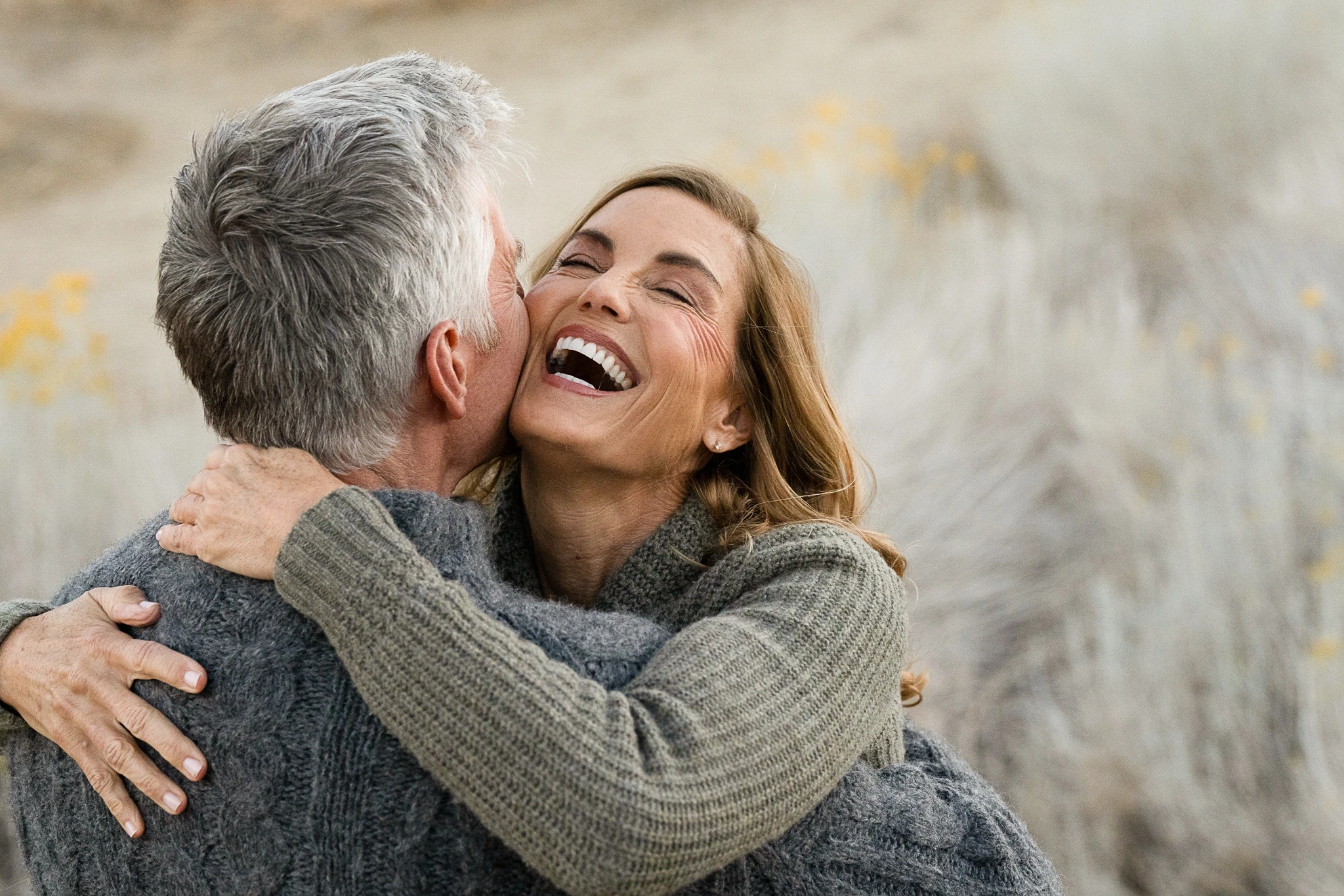 Young black woman witting at the table working on a laptop
