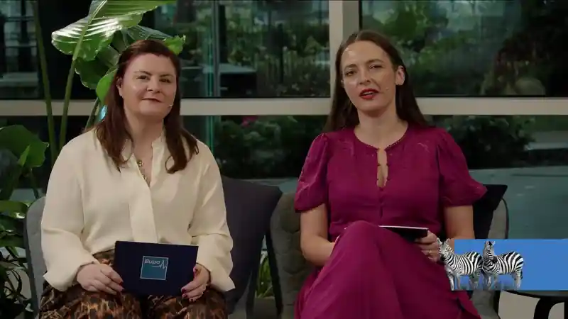 Hosts presenting live during the streamed Bupa strategy cascade, seated on a studio set.