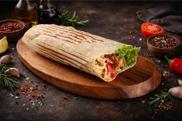 cheese burger on a wooden surface