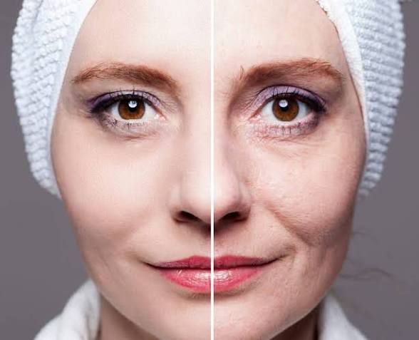 Woman receiving facial treatment with metal tools.