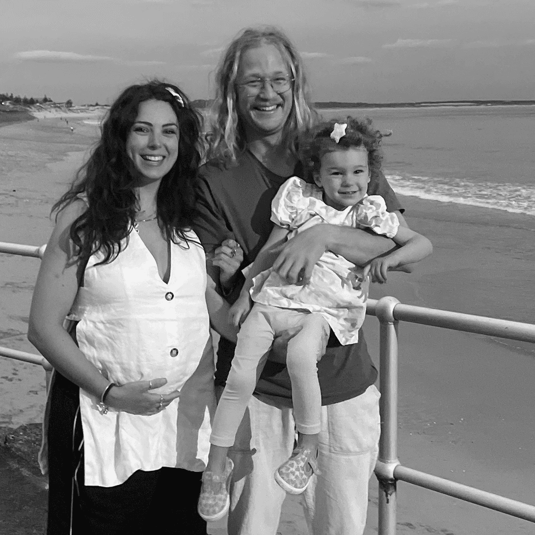 a black and white photo of a woman in a dress