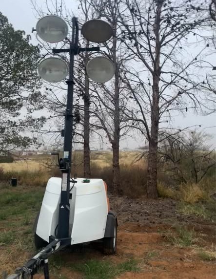 a man in a yellow shirt is working on a roof