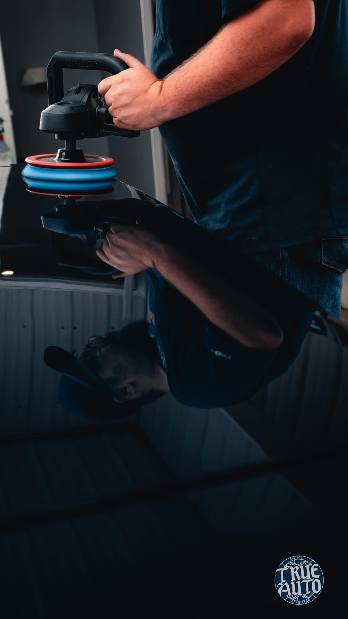 Blue truck in a garage