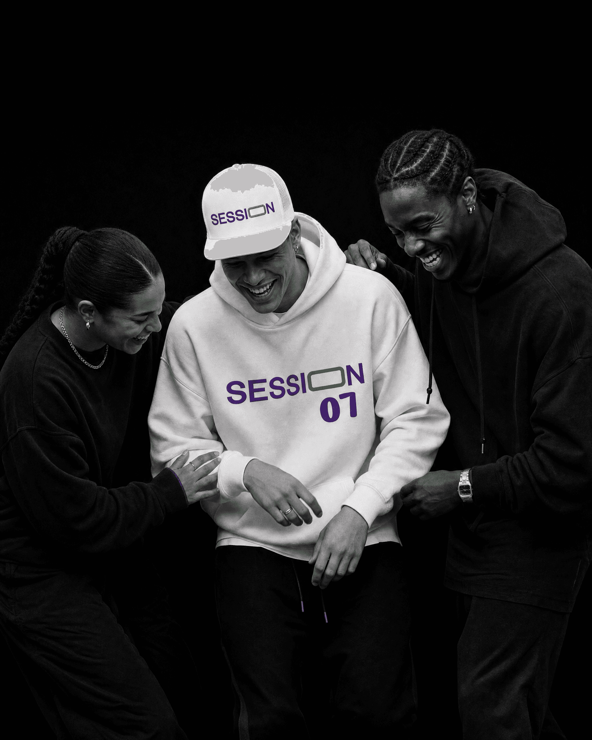 Three friends laughing, with the center person wearing a white Session Zone cap and matching 07 hoodie.
