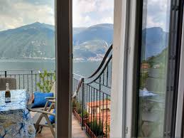 brown rocky mountain beside sea during daytime