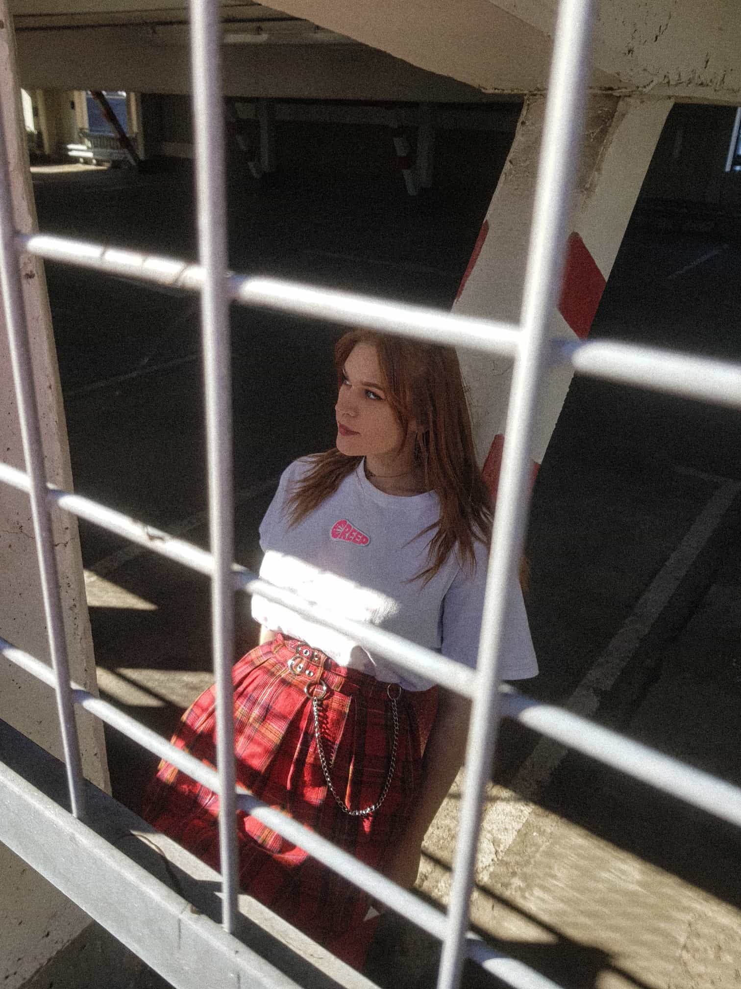 Photograph of streetwear model wearing creep branded clothing.