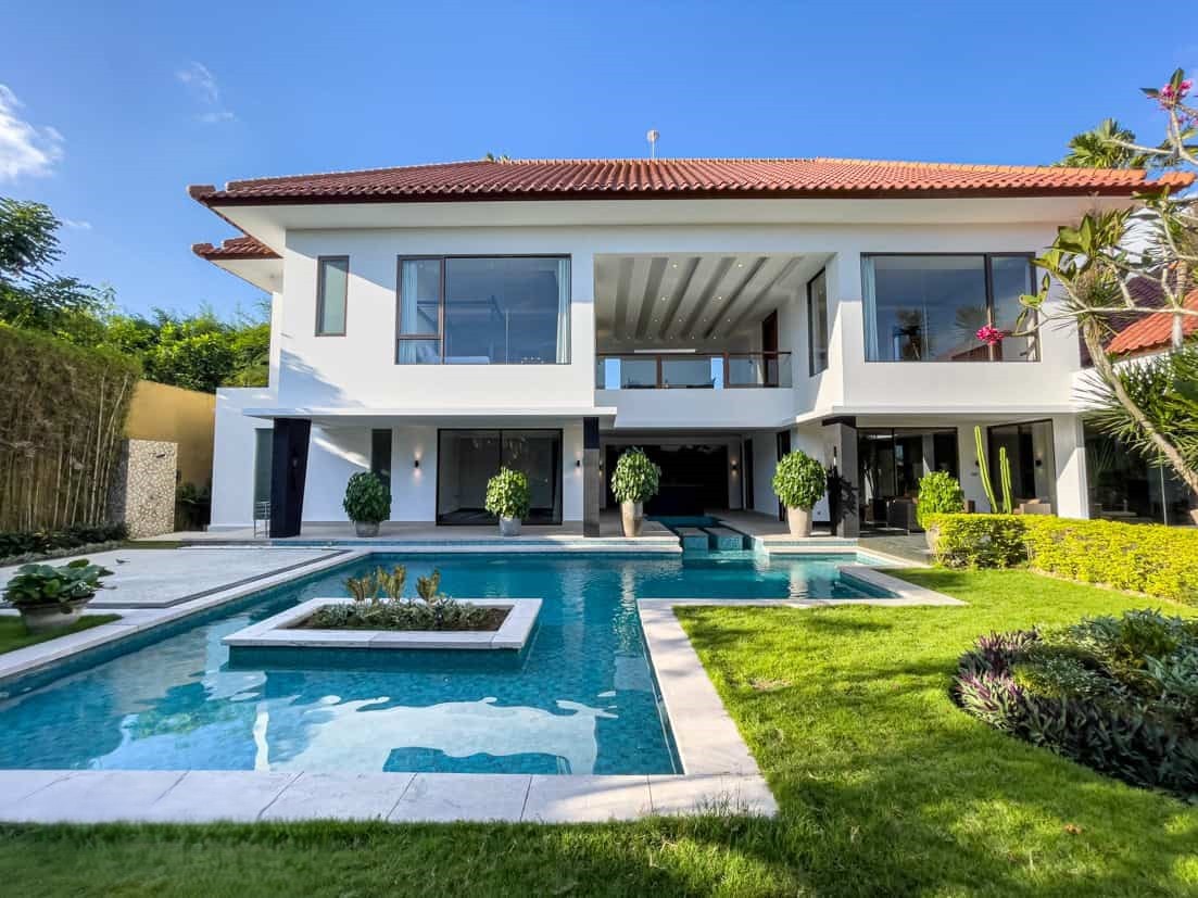 Luxury outdoor living and dining area by a private pool at Nyanyi, ideal for high-end lifestyle seekers.