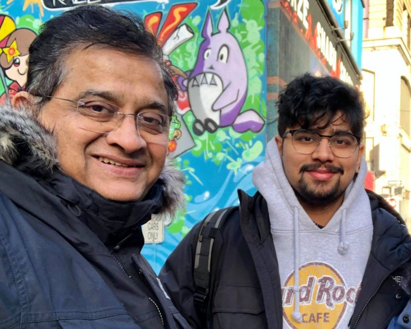 Rajesh Nagjee with his son Jay, smiling in front of street art — a reminder that leadership is about life, not just business.