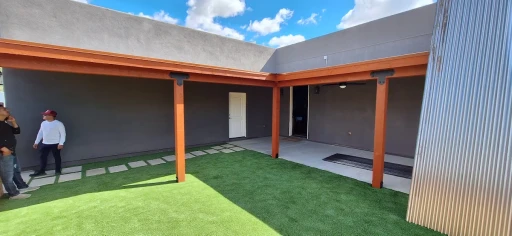 Covered patio with turf in a Tucson yard