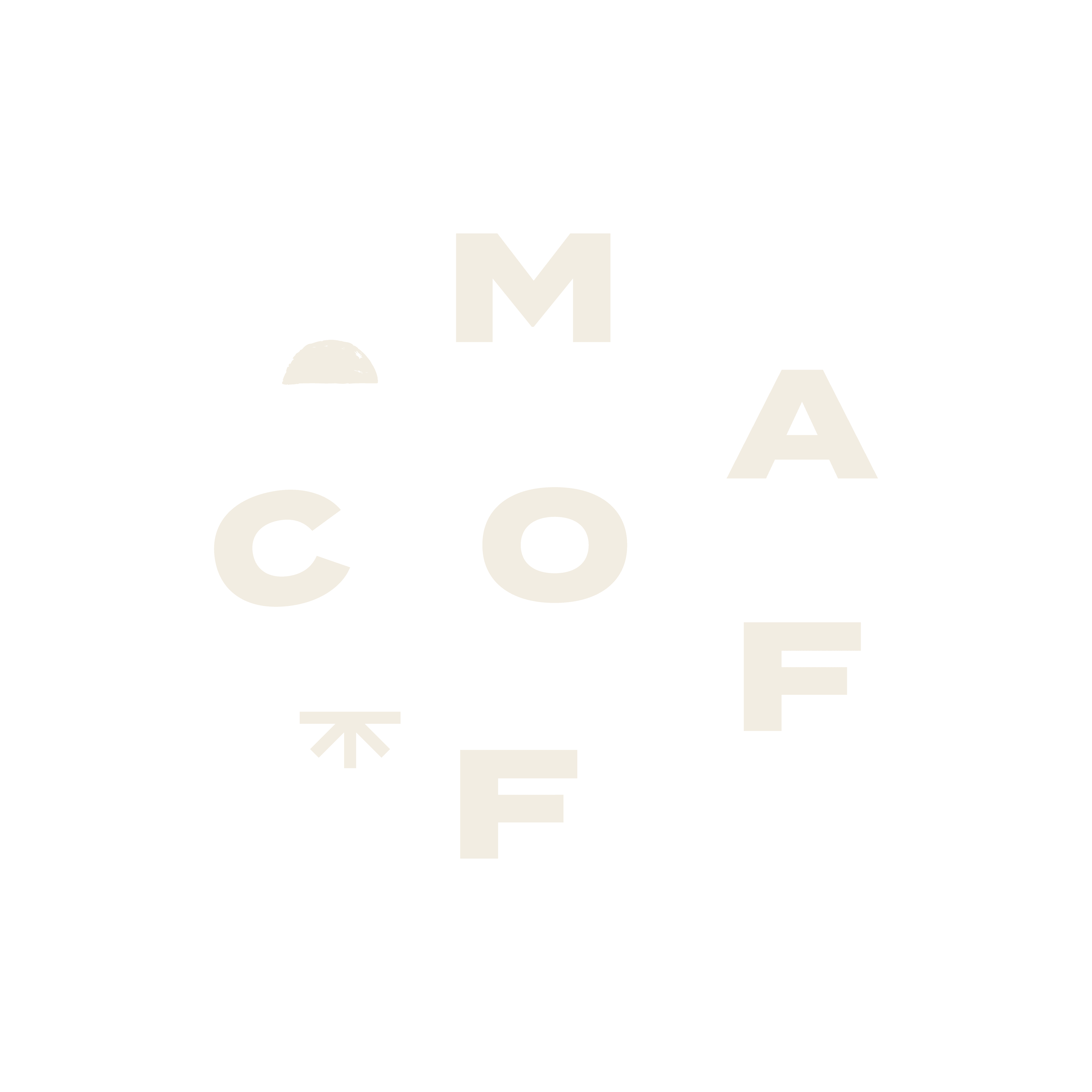 A close-up of a hand wearing multiple decorative rings against a blue background.