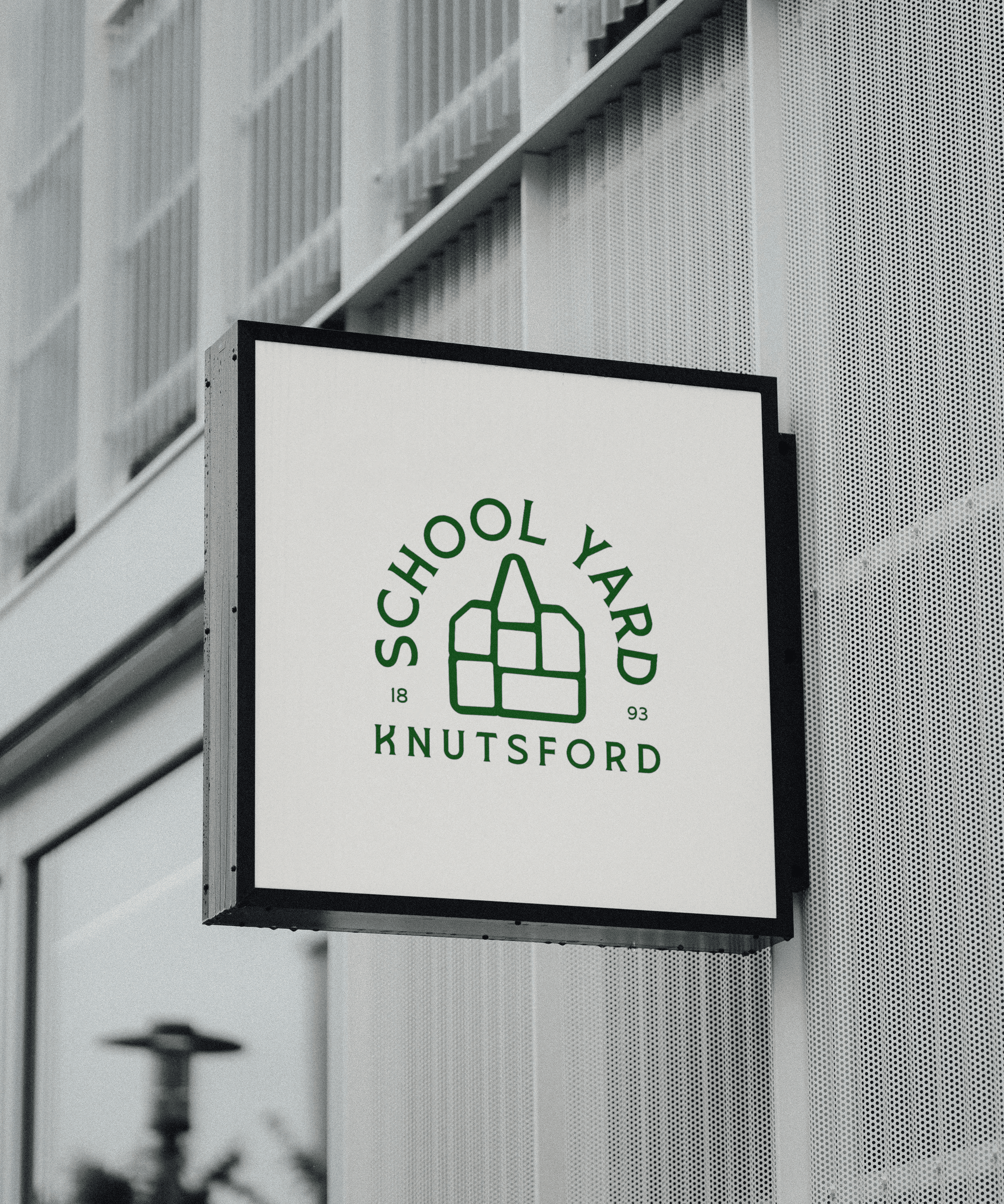 White outline of a classic smiley face followed by the text “Smiley Co” in white serif type on a vivid orange background.