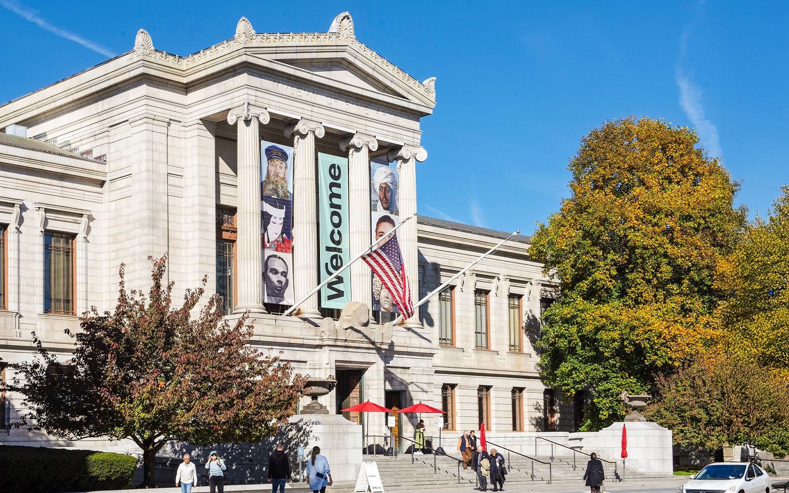Museum of Fine Arts Boston exterior with banners and visitors.