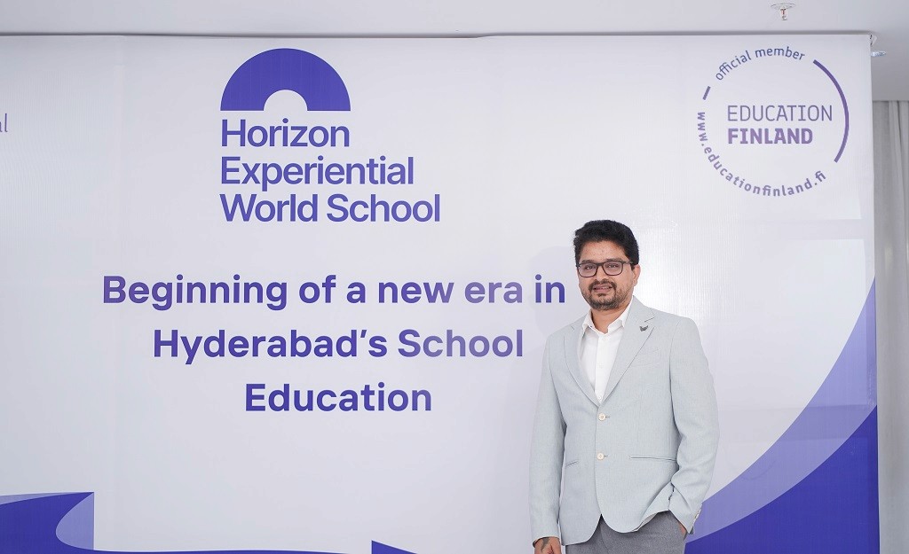 A school building stands against the backdrop of a clear sky