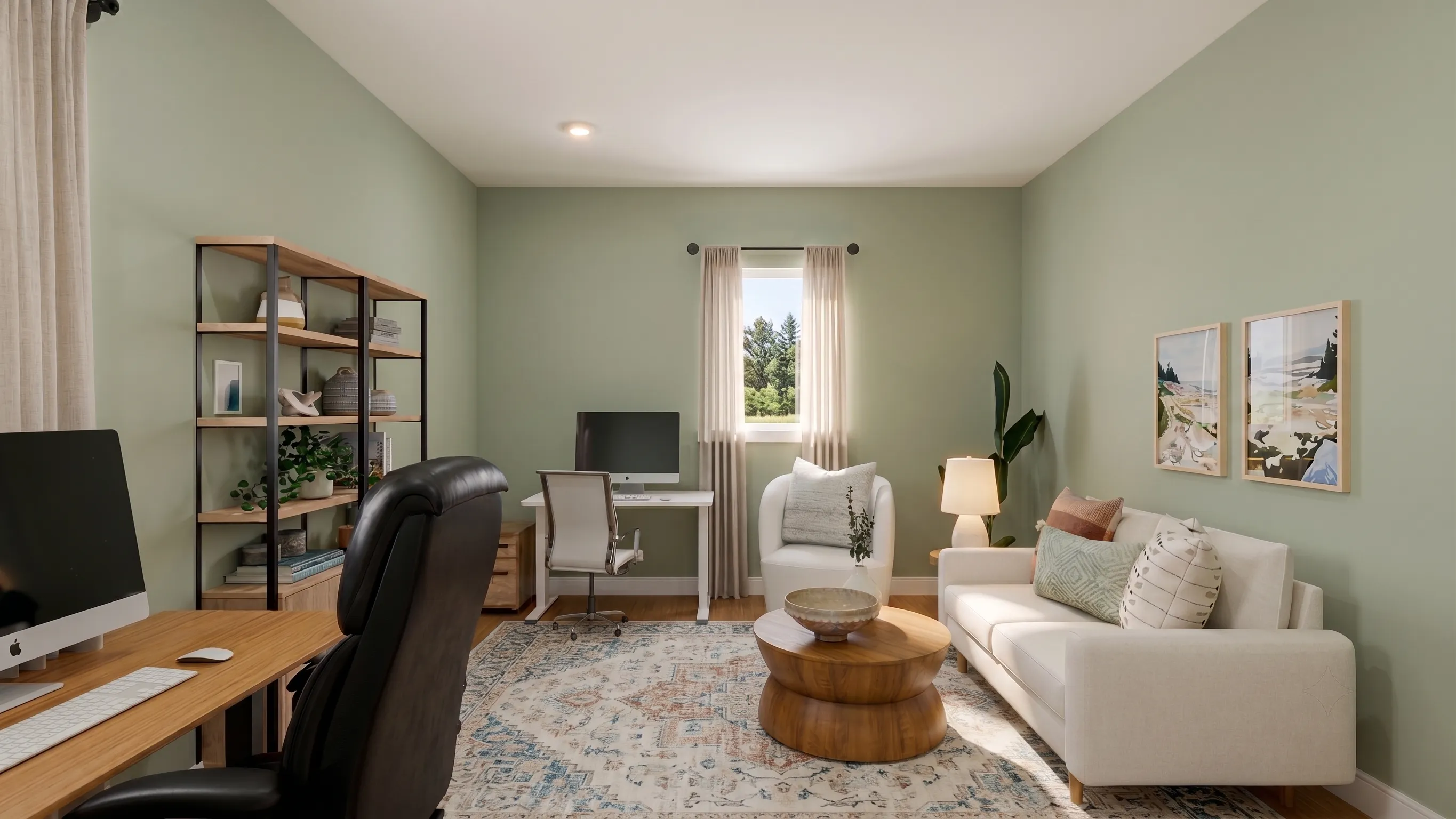 Stylish home office with sage green walls, dual workstations, a modern white sofa with accent pillows, layered wood coffee tables, and a tall open bookshelf. Natural light, warm wood flooring, and soft neutral decor create a calming, functional workspace.