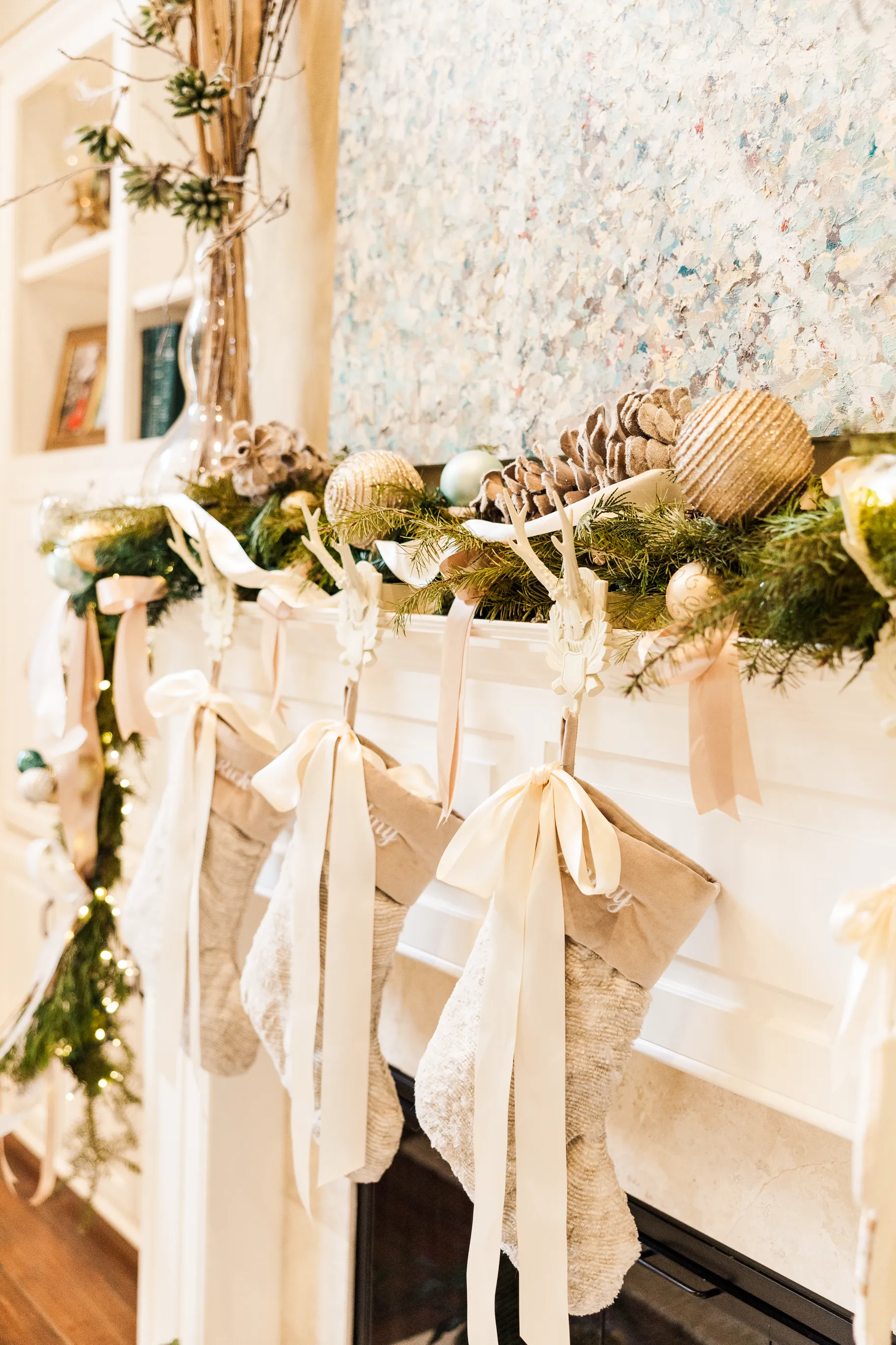 Luxury table setting by Sarah Overall Events with pink embroidered napkins, gold-rimmed plates, floral arrangements, and personalized menus in Shreveport.